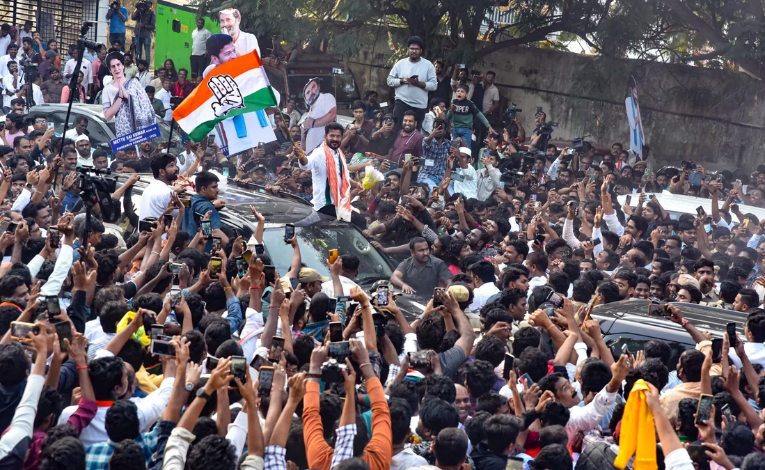 Revanth Reddy greets supporters at Gandhi Bhavan in Hyderabad.