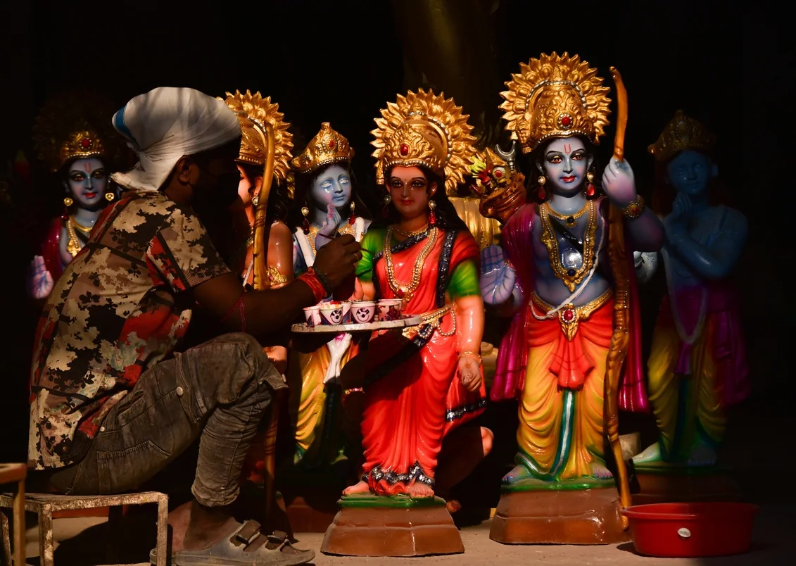 An artisan paints statues of Hindu deities ahead of Ram Navami at a Hyderabad workshop.